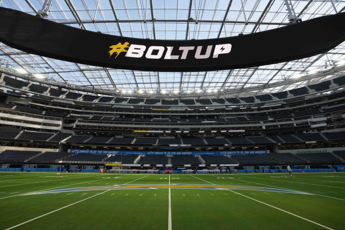 Dec 12, 2021; Inglewood, California, USA; A detailed view of the Los Angeles Chargers logo at the 50-yard line and Oculus video board at SoFi Stadium. Mandatory Credit: Kirby Lee-USA TODAY Sports